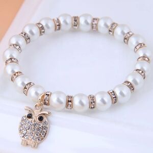 Elegant Pearl and Gold Owl Charm Bracelet